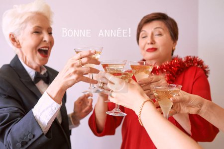 Photo for New year celebrating hands with glasses of white sparkling wine. Christmas, family, friends, celebrating, new year concept - Royalty Free Image