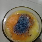 orange and selasih smoothie in a glass