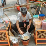 Jakarta, Indonesia - October 8 2012: Traditional Street Vendor of Kerak Telor, the Betawi traditional spicy omelette dish in Indonesian cuisine.