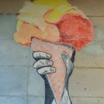 Bogor, Indonesia - December 13, 2023: painting of a hand holding an ice cream cone on the wall