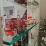 miniature models of cars on glass shelves