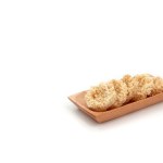 Rengginang or Rangginang, Traditional Indonesian Rice Crackers, made from rice or sticky rice. Savory and crunchy. Served on a wooden plate and isolated on a white background.
