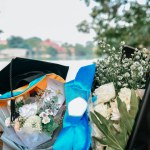 graduation caps and flower arrangements