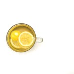 cup of water with honey and lemon slices, isolated white background, top view