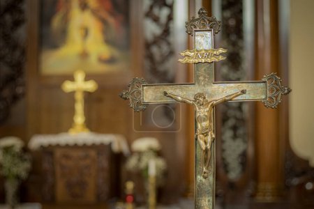 Photo for Church cross made of silver with Jesus Christ. Altar church with crosses. Soft selective focus. Artificially created grain for the picture - Royalty Free Image