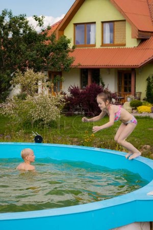 Children swim alone in the pool. Children by the pool. Children's safety near water bodies