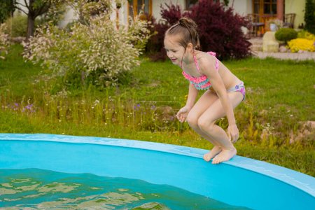 Photo for A child drowns alone in a pool. A child by the pool of water. Children's safety near water bodies - Royalty Free Image