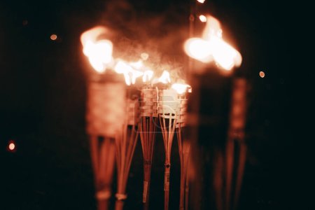 Photo for Glowing Bonfire Illuminates the Night with Radiant Heat. A bright bonfire illuminates the darkness at night. - Royalty Free Image