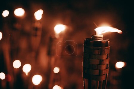 Photo for Glowing Bonfire Illuminates the Night with Radiant Heat. A bright bonfire illuminates the darkness at night. - Royalty Free Image