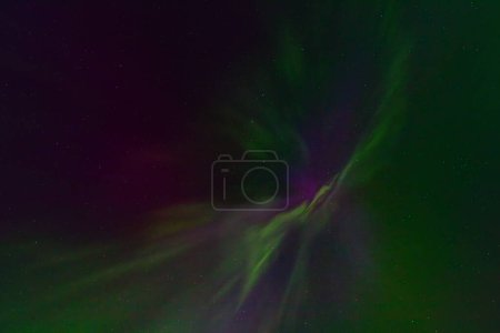 Northern lights at the zenith of the sky. Aurora Borealis or Northern Lights Latvia. Northern lights shining in the sky