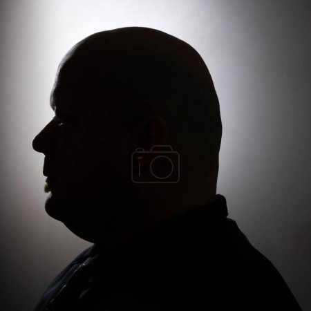 Photo for Silhouette of bald man. - Royalty Free Image