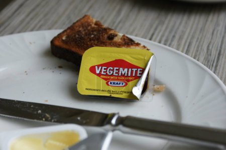 Photo for A closeup shot of a slice of bread with Vegemite - Royalty Free Image