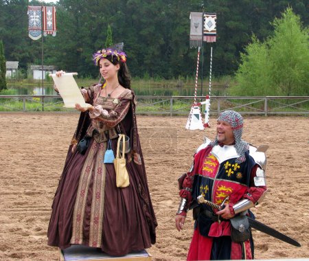 Photo for Fair Maiden Reads Declaration at Texas Ren Festival - Royalty Free Image