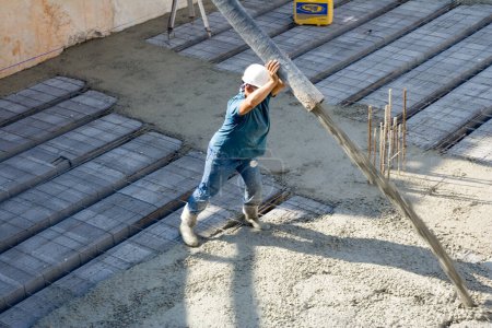 Photo for Male constructor working with cement - Royalty Free Image