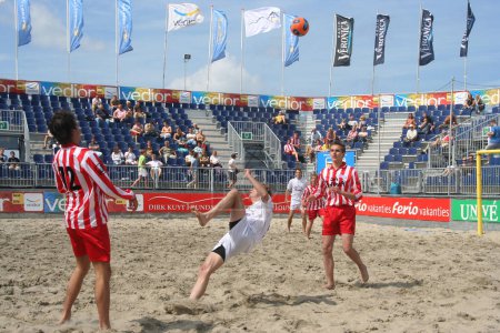 Photo for Men playing Beach Soccer - Royalty Free Image