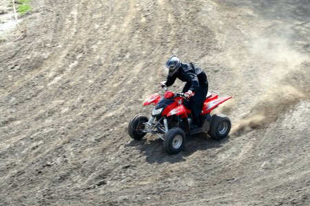 Photo for Man on quad bike during a race - Royalty Free Image