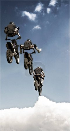 Photo for Freestyle motocross riders jumping - Royalty Free Image