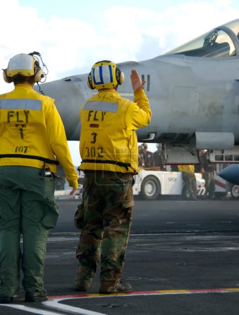 Photo for Sailors at work on flight deck - Royalty Free Image