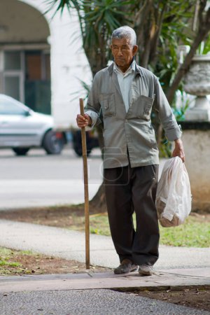 Photo for Old man with a crutch - Royalty Free Image