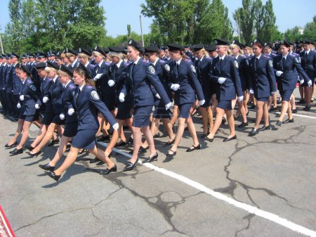 Photo for Graduates of university, group of females marching - Royalty Free Image