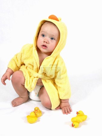 Photo for Cute infant in yellow clothes - Royalty Free Image