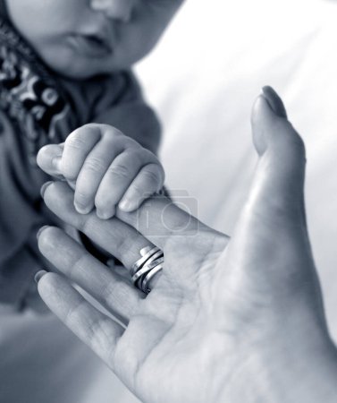 Photo for Black and white photo of newborn baby and mother hands - Royalty Free Image