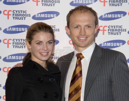 Photo for LONDON - FEBRUARY 28: Matt Dawson and guest arrive at the Samsung Gala Dinner in Aid of Cystic Florosis Trust at Bluebird Restaurant on February 26, 2008 in London England - Royalty Free Image