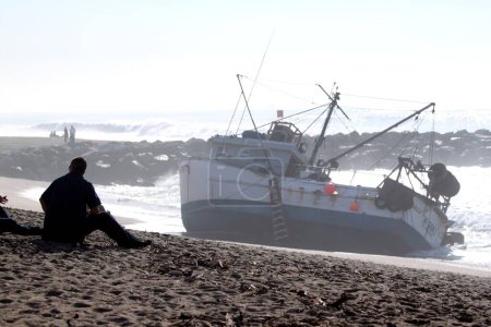 Photo for Fishing Boat Rescue on sea coast - Royalty Free Image