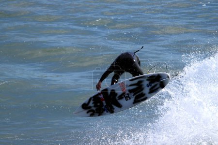 Photo for Surfer with surfboard. Summer leisure activity - Royalty Free Image