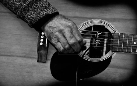 Photo for Person playing on classic guitar - Royalty Free Image