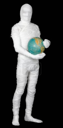 Photo for Man in costume mummy and terrestrial globe - Royalty Free Image