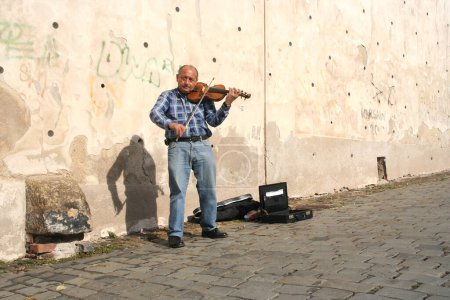 Photo for Man performer playing violin on the street - Royalty Free Image