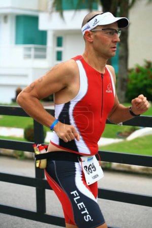 Photo for FLORIANOPOLIS - SANTA CATARINA, BRAZIL, MAY 31: An unidentified competitor races in the Ironman triathlon competition held in Florianopolis - Santa Catarina - Brazil, on May 31, 2009. - Royalty Free Image