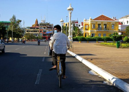 Photo for Cambodian man cycling on the street - Royalty Free Image