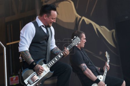 Photo for Volbeat, man sings and plays guitar - Royalty Free Image