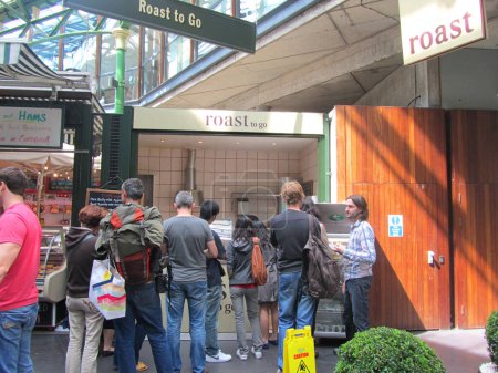 Photo for Queue of people at roast meat stall at Borough Market on August - Royalty Free Image