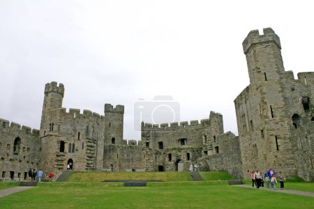Photo for Tourists at Caernarfon Castle in North Wales - Royalty Free Image