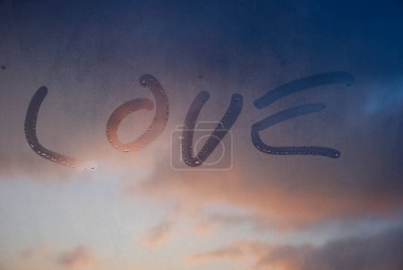 Photo for Condensation on the window with Word love - Royalty Free Image