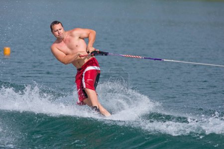 Photo for ABBOTSFORD, BC - AUGUST 4: Jason Matthews from the Calgary Fire Dept competes in the waterskiing trick event at the World Police and Fire games Aug 4, 2009 in Abbotsford, BC. - Royalty Free Image