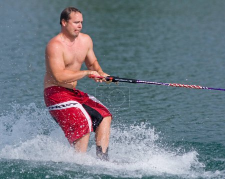 Photo for ABBOTSFORD, BC - AUGUST 4: Jason Matthews from the Calgary Fire Dept competes in the waterskiing trick event at the World Police and Fire games Aug 4, 2009 in Abbotsford, BC. - Royalty Free Image