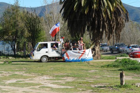 Photo for People celebrating Bicentenary of Chile on car - Royalty Free Image