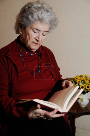 Photo for Senior woman reading book - Royalty Free Image