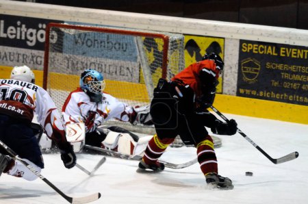 Photo for ZELL AM SEE, AUSTRIA - NOVEMBER 28: Salzburg hockey League. Great save by Schuettdorf Goalie Peter Hochwimmer. Game between SV Schuettdorf and Devils Salzburg (Result 2-13) on November 28, 2010, at the hockey rink of Zell am See - Royalty Free Image