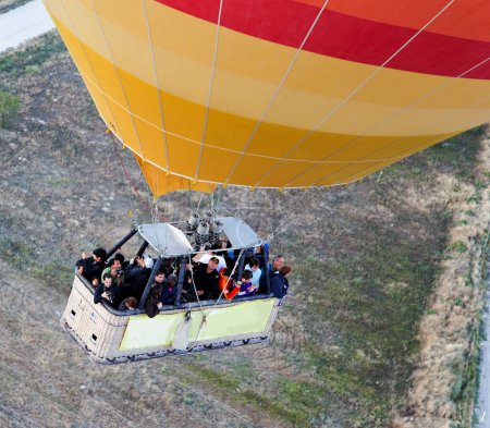 Photo for Basket of people hot air balloon from overhead - Royalty Free Image