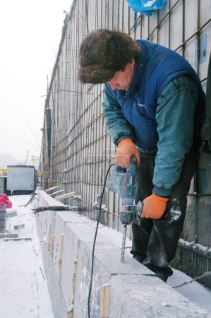 Photo for KYIV, UKRAINE - JANUARY 31: Worker at construction site of Podolsko-Voskresensky bridge during open doors day on January 31, 2007 in Kyiv, Ukraine - Royalty Free Image