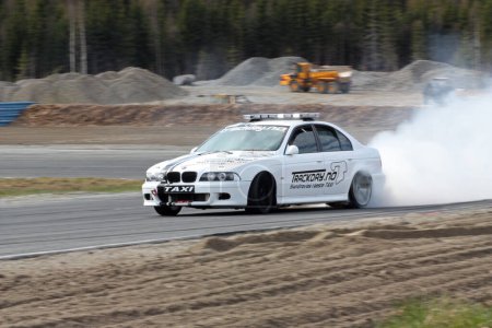 Photo for BMW Drift Taxi riding at drift show, motion shot - Royalty Free Image