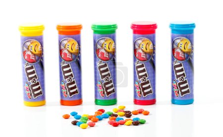 Photo for Containers of M&M Minis on white background - Royalty Free Image