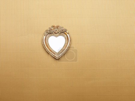 Photo for Heart Picture Frame hanging on wall - Royalty Free Image