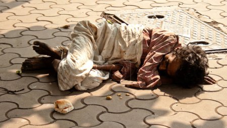 Photo for Poor man lying on the streets of Bombay - Royalty Free Image