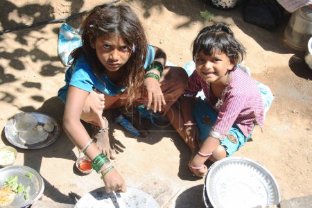 Photo for Indian children preparing lunch - Royalty Free Image